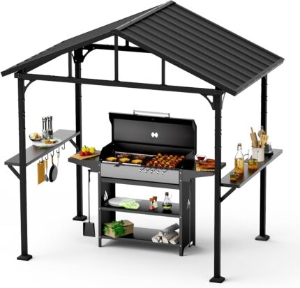 The gazebo set up outdoors with hardtop roof and side table for grilling.