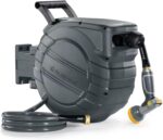 The retractable garden hose providing efficient watering for plants with brass connectors.